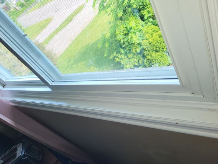Residential windowsill after being cleaned. Free of dirt, mould, or grime, bright white.