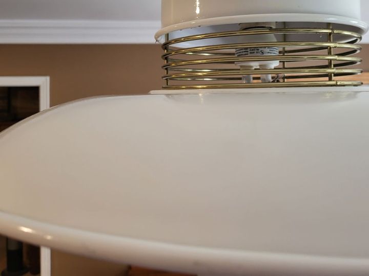 Residential light fixture after being cleaned. Bright white and clear of dirt or dust.
