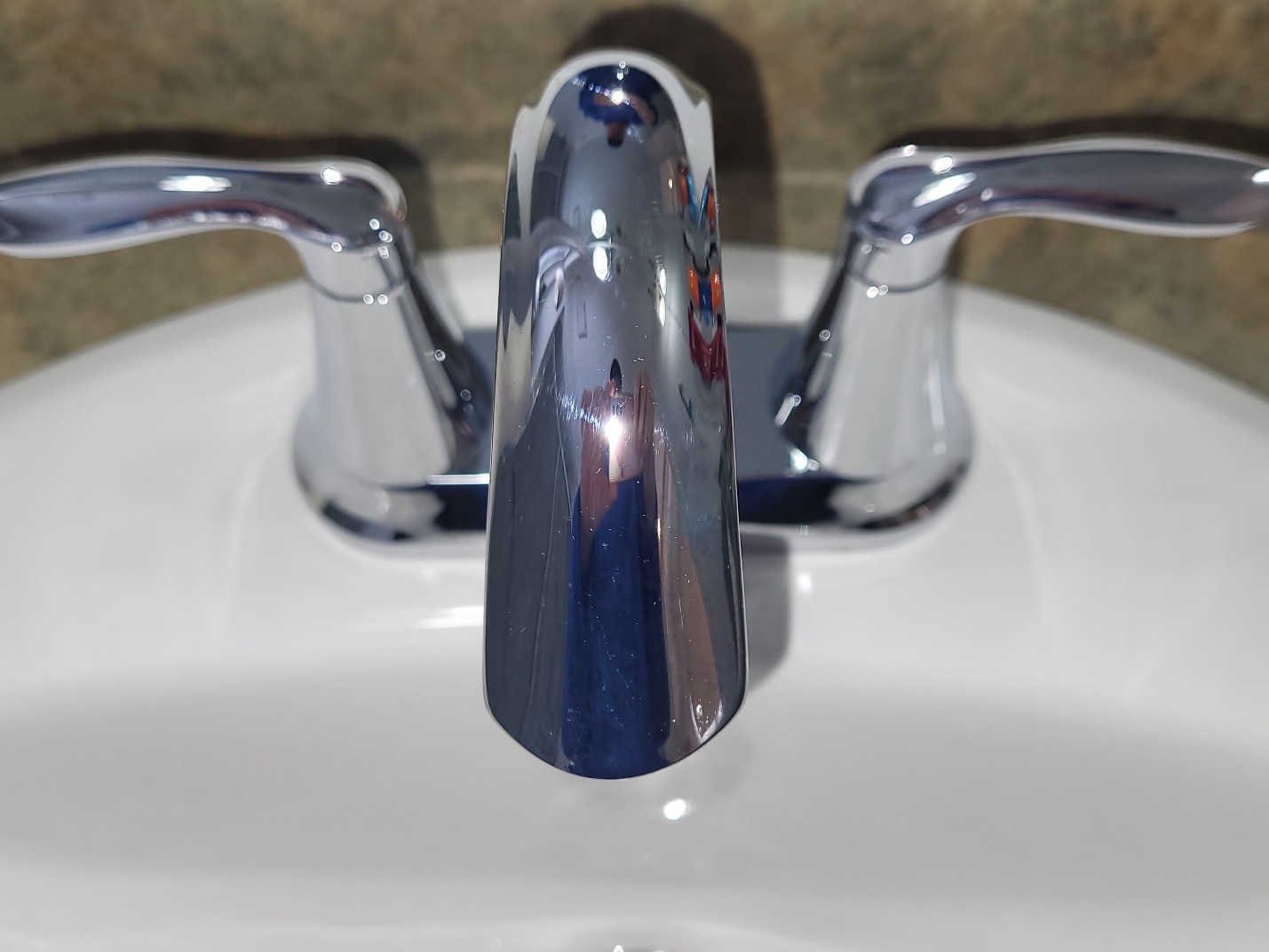 Chrome sink taps and faucet after cleaning. Bright and shiny.