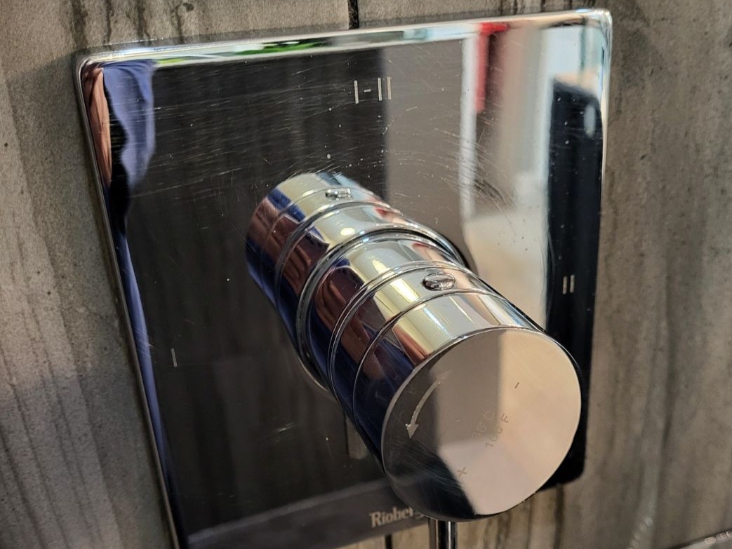 Chrome shower tap after cleaning. Bright and shiny.