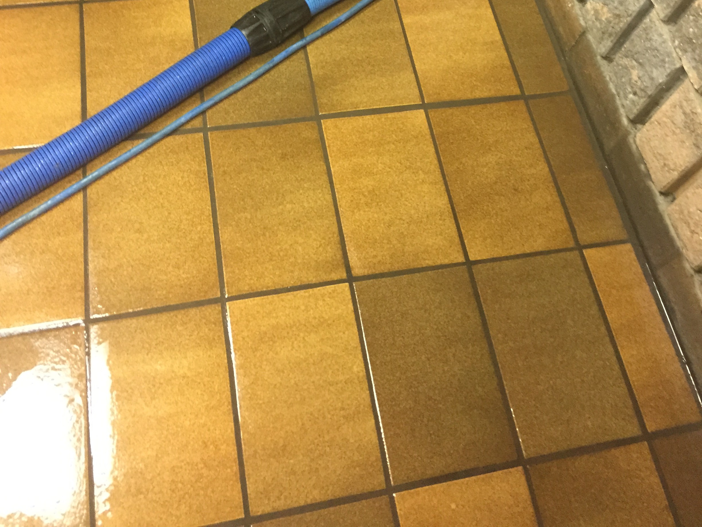 Brown tile floor after cleaning